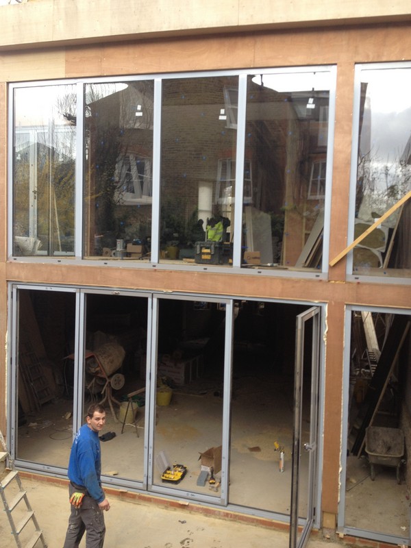 Aluminium bi-fold doors with two-storey glazing in Notting Hill