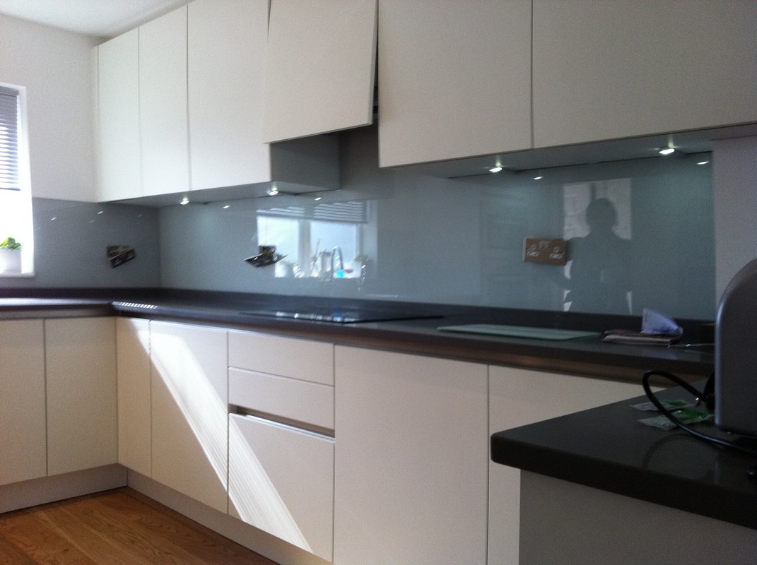 Grey glass kitchen splashback with LED lighting in Notting Hill